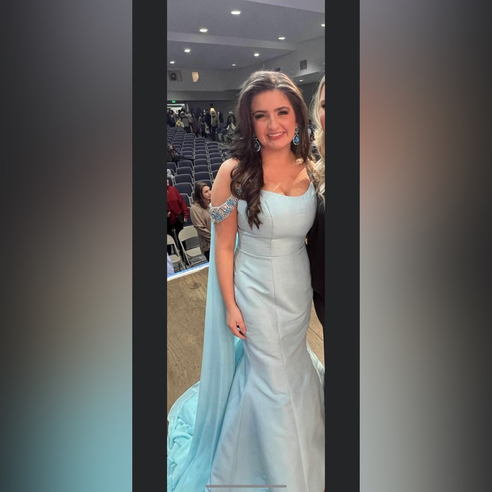 Sherri Hill size 8. Added long cape and hemmed but can be let out.